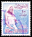 Postage stamp printed in Sudan shows Cotton Picker, Indigenous motifs serie, 10 Sudanese millim, circa 1975