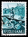 Postage stamp printed in Suriname shows Poling canoe, Native life and fauna serie, circa 1953