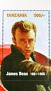 Postage stamp printed in Tanzania shows James Dean in a car, James Dean serie, circa 1996 Royalty Free Stock Photo