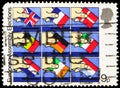 Postage stamp printed in United Kingdom shows Hands placing National Flags in Ballot Boxes, European Assembly Elections serie,