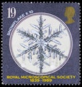 Postage stamp printed in United Kingdom shows Snowflake x 10, Royal Microscopical Society serie, circa 1989 Royalty Free Stock Photo