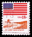 Postage stamp printed in United States shows For Amber Waves of Grain - Flag and field of wheat, Flag and Anthem Issue serie,