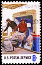 Postage stamp printed in United States shows Postal Service: Loading Mail on a Truck, Postal Service Employees Issue serie, circa