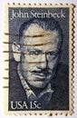 A postage stamp printed in United States USA shows famous American writer John Ernst Steinbeck Jr circa 1979