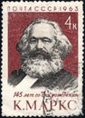 Postage stamp printed in the USSR with a portrait of Karl Marx 1818-1883 and the inscription in Russian `145 years since birth`.