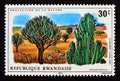 Postage stamp Rwanda, 1975. Antelope and zebra in the savanna