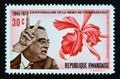 Postage stamp Rwanda, 1970. Franklin Delano Roosevelt and Laeliocattleya callistoglossa orchid flower