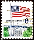 Postage stamp showing Flag and White House Royalty Free Stock Photo