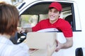 Postal delivery courier delivering Royalty Free Stock Photo