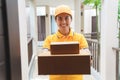 Postal lady delivers the mailbox in front of the house