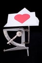 Postal scale with Valentine's letter Royalty Free Stock Photo