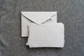 A postal set of handmade envelopes and sheets of paper lie on a gray surface. Paper recycling and zero waste concept Royalty Free Stock Photo