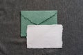 A postal set of handmade envelopes and sheets of paper lie on a gray surface. Paper recycling and zero waste concept Royalty Free Stock Photo