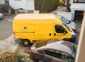 Postal van leaving after parcel delivery