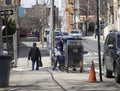 Postal worker empties mail box in Bronx NY community