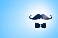 Postcard with a blue mustache and bow tie to the father`s day