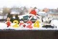 postcard for business New Year\'s greetings. two toy excavators, souvenirs, numbers 2024 in the snow Royalty Free Stock Photo