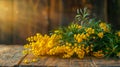 A postcard depicting a fresh and beautiful mimosa on a wooden background, strewn with yellow flowers, conveys the idea
