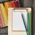 Postcard with Envelope and Pencils on Clipboard Royalty Free Stock Photo