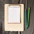 Postcard with Envelope and Pencils on Clipboard Royalty Free Stock Photo