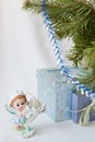 Postcard greetings happy New year, magic elf, fir branch, candle holder, Christmas gifts under the tree, the angel candle, on a wh Royalty Free Stock Photo