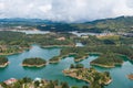 Postcard of Guatape in Colombia Latin America with a tropical scene of water and vegetation Royalty Free Stock Photo