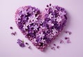 Postcard with a heart made of purple and lilac flowers, light background
