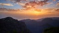 Postcard from Madeira. Sunset over mountains of Pico do Arieiro. Twilight, sun touches ocean.