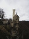 Postcard panorama of medieval Schloss Lichtenstein castle on hill cliff edge in Echaz valley Honau Reutlingen Germany