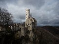 Postcard panorama of medieval Schloss Lichtenstein castle on hill cliff edge in Echaz valley Honau Reutlingen Germany Royalty Free Stock Photo
