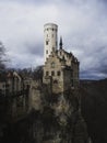 Postcard panorama of medieval Schloss Lichtenstein castle on hill cliff edge in Echaz valley Honau Reutlingen Germany Royalty Free Stock Photo