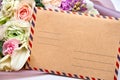 Postcard with a postal envelope and a bouquet of flowers for greeting Royalty Free Stock Photo