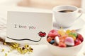 Postcard with the text I love you on a table Royalty Free Stock Photo