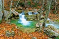 a postcard view in a beautiful natural location in the autumn mountain forest small waterfalls Royalty Free Stock Photo