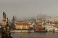 Postcard view of Prague Castle in mist from Charles Bridge,Czech republic.Famous tourist destination.Prague panorama.Foggy morning