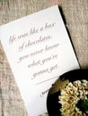 Postcard with words from Forrest Gump and flower Royalty Free Stock Photo