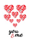 Postcard with the words You and me in italics. Red heart is laid out of red feathers and decorative silver keys. Top view, flat