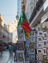 Postcards and National Flag inside Exhibitor in Lisbon Shop, Portugal