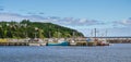 Postcards from Newfoundland. Newfoundland fishing villages see boats at rest for the day on calm coastal water.