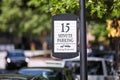 Posted sign `15 minutes parking` with tow-away icon Royalty Free Stock Photo