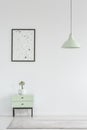 Poster above cabinet with plant in white minimal living room int Royalty Free Stock Photo