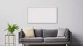 Poster above white cabinet with plant next to grey sofa in simple living room interior. Real photo Royalty Free Stock Photo