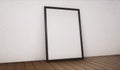 Poster with black frame mockup standing on the floor. 3d rendering Royalty Free Stock Photo