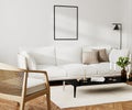 Poster blank frame mock up in home living room interior with white sofa and coffee table with decor, 3d rendering Royalty Free Stock Photo