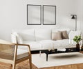 Poster blank frame mock up in home living room interior with white sofa and coffee table with decor, 3d rendering Royalty Free Stock Photo