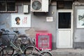 Poster of Chinese hero Lei Feng on the wall of a residential street in Beijing