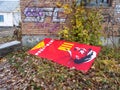 Poster dedicated to Lenin`s 110 year anniversary was thrown away on school backyards Royalty Free Stock Photo