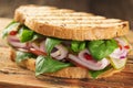 Poster delicious ham sandwich close-up on wooden kitchen board,top view Royalty Free Stock Photo