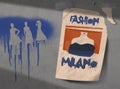 A poster for fashion week in Milan is seen taped to a concrete wall
