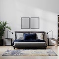 Poster frame mock up in home bedroom interio with bed and dark blue pillow, bedside tables, plant with white wall, 3d illustration Royalty Free Stock Photo